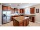 Spacious kitchen boasts a large island, granite countertops, stainless steel appliances, and ample cabinet space at 5110 W Sweet Iron Pass, Phoenix, AZ 85083
