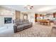 Inviting living room with a fireplace, comfortable seating, and seamlessly connects to the dining and kitchen areas at 5110 W Sweet Iron Pass, Phoenix, AZ 85083