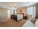 Comfortable primary bedroom featuring neutral tones, plush carpet, and a ceiling fan at 5110 W Sweet Iron Pass, Phoenix, AZ 85083