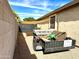 Outdoor shot of a trailer parked in the driveway near a light beige house with brown fencing at 6203 W Wikieup Ln, Glendale, AZ 85308