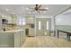 Bright and airy kitchen with modern cabinets, stainless steel appliances, and tile flooring at 6418 W Thomas Rd, Phoenix, AZ 85033