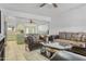 Comfortable living room with tile floors that flows into the kitchen, offering an open-concept living space at 6418 W Thomas Rd, Phoenix, AZ 85033