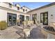 Back patio with lounge seating and brick fire pit, perfect for entertaining outdoors at 6440 E Exeter Blvd, Scottsdale, AZ 85251