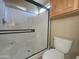 A modern bathroom featuring a frameless glass shower and toilet at 650 N Hawes Rd # 4834, Mesa, AZ 85207