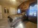 Bedroom with decorative wall, window views and a well made bed at 650 N Hawes Rd # 4834, Mesa, AZ 85207