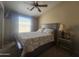 Comfortable bedroom with vaulted ceiling, large window for natural light, carpet and ceiling fan at 650 N Hawes Rd # 4834, Mesa, AZ 85207