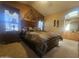 Inviting bedroom featuring a decorative wall and cozy bedding at 650 N Hawes Rd # 4834, Mesa, AZ 85207