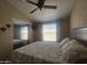 Cozy bedroom with a plush bed, mirrored closet and a window for natural light at 650 N Hawes Rd # 4834, Mesa, AZ 85207
