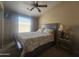 Comfortable bedroom featuring neutral walls, cozy bedding, and a ceiling fan at 650 N Hawes Rd # 4834, Mesa, AZ 85207