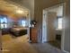 Hallway view into bedrooms with doorways and neutral colored walls at 650 N Hawes Rd # 4834, Mesa, AZ 85207