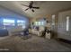 Cozy living room with vaulted ceilings, neutral carpet, sofas and large windows for natural light at 650 N Hawes Rd # 4834, Mesa, AZ 85207