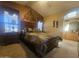 Primary bedroom suite boasts accent wall, ensuite bathroom, carpet and vaulted ceiling at 650 N Hawes Rd # 4834, Mesa, AZ 85207