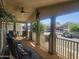 Covered porch boasts comfortable seating and a view of the street, offering a relaxing outdoor space at 650 N Hawes Rd # 4834, Mesa, AZ 85207