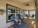Relaxing porch area featuring comfortable seating, ceiling fan, and a view of the outdoors at 650 N Hawes Rd # 4834, Mesa, AZ 85207