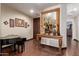 Elegant foyer with a beautiful floor, decorative table and mirror, and interior door at 6935 N Valley Rd, Eloy, AZ 85131