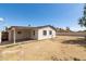 Expansive backyard with a covered patio and privacy fence at 743 E Holmes Ave, Mesa, AZ 85204