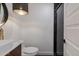 Modern bathroom with a vessel sink and patterned light fixture at 743 E Holmes Ave, Mesa, AZ 85204