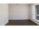 Bright room with fresh white walls and a large window at 743 E Holmes Ave, Mesa, AZ 85204