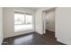 Bright room with fresh white walls and a large window at 743 E Holmes Ave, Mesa, AZ 85204
