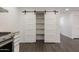 Kitchen area with stainless steel appliances and barn door access at 743 E Holmes Ave, Mesa, AZ 85204