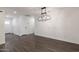 Open living room features contemporary lighting and new flooring at 743 E Holmes Ave, Mesa, AZ 85204