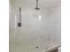 Glass shower with marble tiled walls, and a rainfall shower head at 743 E Holmes Ave, Mesa, AZ 85204