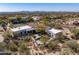 Aerial view showcases a desert home with mountain views, pool, and desert landscaping at 9370 E Calle De Las Brisas --, Scottsdale, AZ 85255