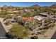 An aerial view of a stunning estate featuring red tile roofing and desert landscaping at 9370 E Calle De Las Brisas --, Scottsdale, AZ 85255