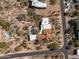 An aerial view of a desert estate with a pool and mountain views in the background at 9370 E Calle De Las Brisas --, Scottsdale, AZ 85255