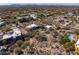 Aerial view of a home surrounded by mature desert landscaping and other homes in the community at 9370 E Calle De Las Brisas --, Scottsdale, AZ 85255