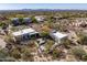 Aerial view showcases desert home with mountain views, pool, and desert landscaping at 9370 E Calle De Las Brisas --, Scottsdale, AZ 85255