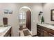 Well-lit bathroom featuring dual vanities with granite countertops and modern fixtures at 9370 E Calle De Las Brisas --, Scottsdale, AZ 85255