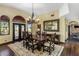 Dining room with a large table, chandelier, and views of the outdoor landscape at 9370 E Calle De Las Brisas --, Scottsdale, AZ 85255