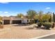 A luxurious home showcasing a paved driveway leading to a multi-car garage and meticulously landscaped front yard at 9370 E Calle De Las Brisas --, Scottsdale, AZ 85255