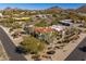 Aerial view of a desert-landscaped estate with a red tile roof and mountain views at 9370 E Calle De Las Brisas --, Scottsdale, AZ 85255