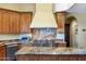 Well-lit kitchen featuring granite countertops, stainless steel appliances, and custom cabinetry at 9370 E Calle De Las Brisas --, Scottsdale, AZ 85255
