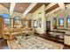 Spacious living room with vaulted ceilings, hardwood floors, and large arched windows at 9370 E Calle De Las Brisas --, Scottsdale, AZ 85255