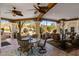 Outdoor patio with dining table and lounge seating overlooking desert landscaping at 9370 E Calle De Las Brisas --, Scottsdale, AZ 85255