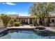 Inviting backyard pool and spa with desert landscaping and views of the home's covered patio at 9370 E Calle De Las Brisas --, Scottsdale, AZ 85255