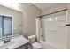 Bathroom featuring a single sink vanity, a framed mirror, and a shower/tub combination with a curtain at 9743 E Torino Ave, Mesa, AZ 85212