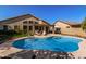 Private backyard pool with covered patio and outdoor seating areas at 987 S Phelps Dr, Apache Junction, AZ 85120