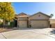 Charming single-story home featuring a three-car garage and desert landscaping at 987 S Phelps Dr, Apache Junction, AZ 85120