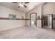 An open main bedroom has neutral walls, a vaulted ceiling, and carpeted flooring at 987 S Phelps Dr, Apache Junction, AZ 85120