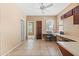 Bedroom featuring a ceiling fan, tile flooring, and built-in desk at 1044 E Stottler Ct, Gilbert, AZ 85296