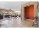 Bright and airy living room featuring tile flooring and plush leather seating at 1044 E Stottler Ct, Gilbert, AZ 85296