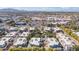 Aerial view of the community showcasing well-maintained landscaping and nearby shopping center at 10757 N 74Th St # 1016, Scottsdale, AZ 85260