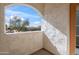 Balcony with stucco walls overlooks trees and surrounding neighborhood at 10757 N 74Th St # 1016, Scottsdale, AZ 85260