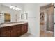 Bathroom features double sinks, granite counters, and a glass enclosed shower/tub at 10757 N 74Th St # 1016, Scottsdale, AZ 85260