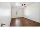 Empty bedroom with wood floors, ceiling fan, and window at 10757 N 74Th St # 1016, Scottsdale, AZ 85260