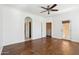 Bright, spacious bedroom with ceiling fan, wood floors, and access to a private balcony at 10757 N 74Th St # 1016, Scottsdale, AZ 85260